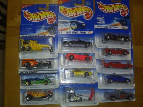1989 Ford F-350 - Several Hot Wheels toy cars are displayed in their original packaging, showing different model series.