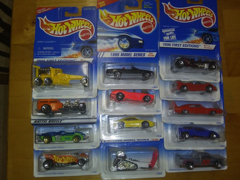 Collection of Hot Wheels toy cars in their packaging, including 1995 and 1996 model series