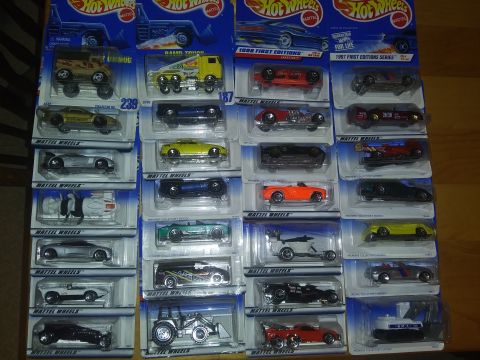 1989 Ford F-350 - A large collection of Hot Wheels toy cars, mostly sports cars and trucks, displayed in their packaging.