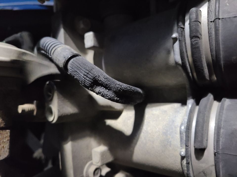 Both rubber elbows in the VMV line were degraded, and this one is collapsing under engine vacuum. Both were replaced with emissions hose.
