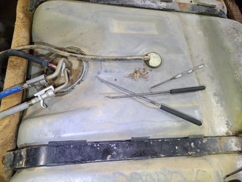 1997 Ford F-250 - Like the wheel arches; getting the gravel out of the tight gap between the frame & tank will stop them from rubbing holes in the galvanizin…