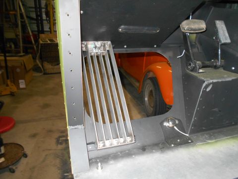 1992 Ford Bronco - Interior view shows the fender and wheel of an orange vehicle.