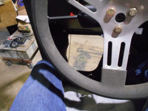 1992 Ford Bronco - Close-up view of a steering wheel and dashboard components in a workshop setting.