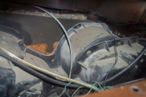 1978 Ford Bronco - Heater blower motor housing with visible rust and wiring.
