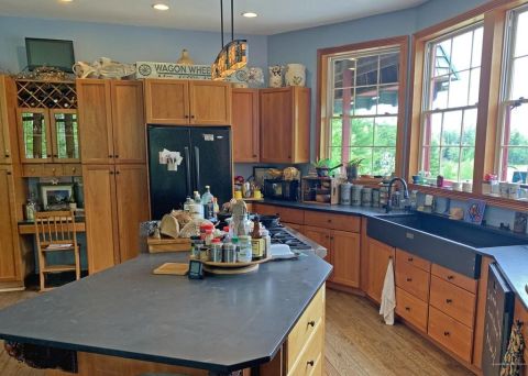 1992 Jeep Wrangler - Interior view of a kitchen with wooden cabinetry and a large island.