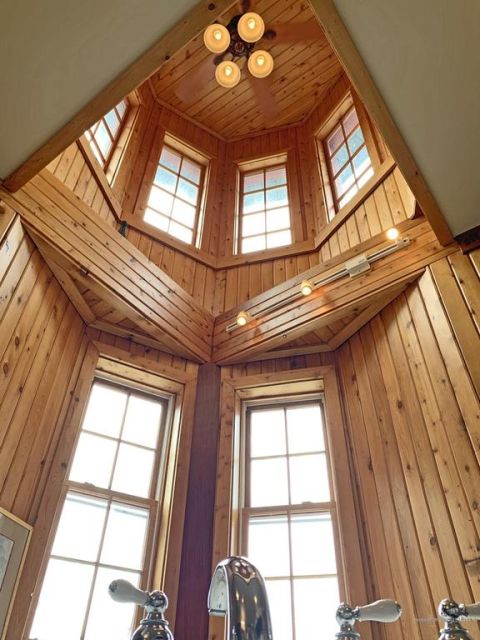 1992 Jeep Wrangler - Interior view of a room with wood paneling and multiple windows, looking upwards.