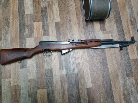 1994 Ford Bronco - A rifle with a wooden stock and a bayonet is displayed on a wooden floor.