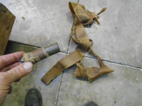 1992 Ford Bronco - A close-up of a disassembled vehicle component, possibly a sensor or electrical part, with associated fabric wrapping.