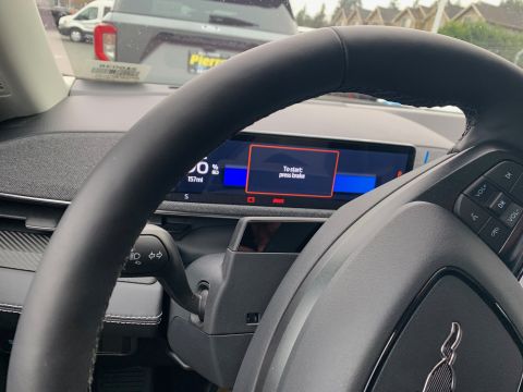 2021 Ford Mustang - The interior of a 2021 Ford Mustang Mach-E shows a digital display with a 'To start: press brake' message.
