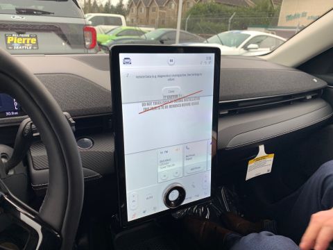 2021 Ford Mustang - Interior view of a 2021 Ford Mustang Mach-E, highlighting the central touchscreen display.