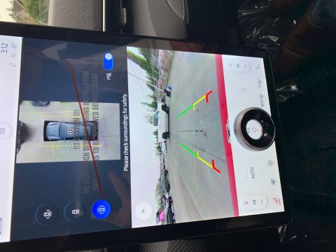 2021 Ford Mustang - Backup camera display shows a white SUV and other vehicles in a parking lot.