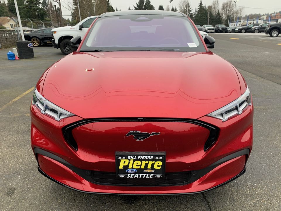 Red Ford Mustang Mach-E front view with horse emblem