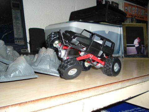 1989 Ford Bronco - Toy rock crawler truck with oversized tires and suspension details.