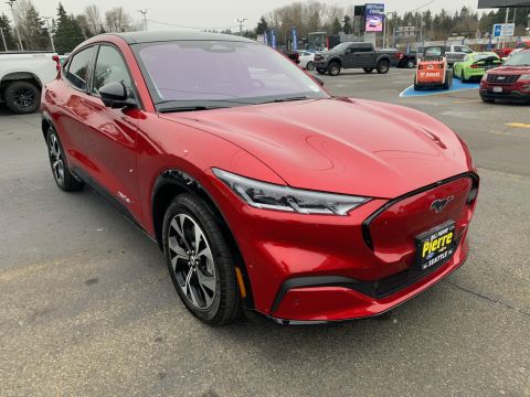 2021 Ford Mustang - Front 3/4 view of a red 2021 Ford Mustang Mach-E electric SUV.