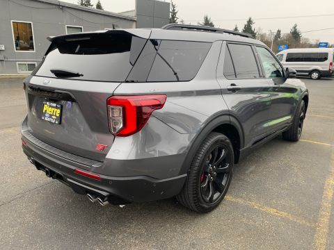 2021 Ford Mustang - The rear of a gray 2021 Ford Explorer ST shows its distinctive ST badging and quad exhaust pipes.
