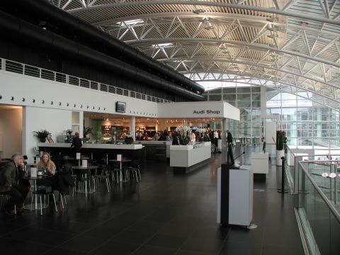 2010 Audi A4 - Interior view of a modern Audi dealership a cafe area and the 'Audi Shop'.