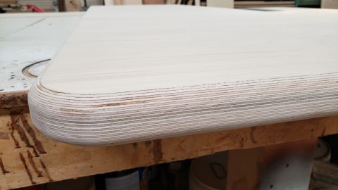 1965 Ford Mustang - Laminated plywood edge detail with visible wood layers.