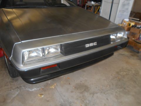 1992 Ford Bronco - Front view of a DeLorean DMC-12, showing the distinctive grille and headlights.