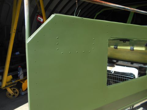 1992 Ford Bronco - A green vehicle body panel is shown, possibly undergoing restoration or repair.