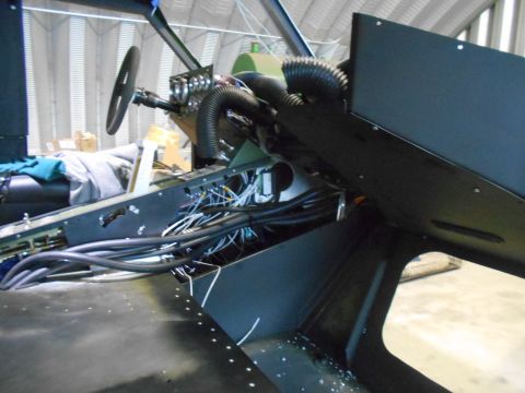 1992 Ford Bronco - The complex wiring and components are visible inside the vehicle's cabin.