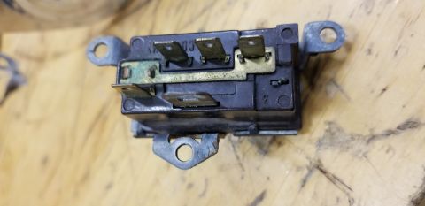 1973 Chevrolet Camaro - Close-up of an electrical relay part with visible terminals and mounting points.