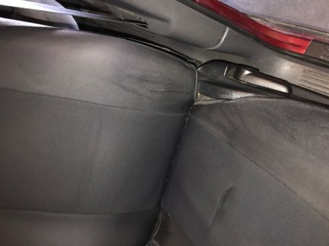 2000 Ford Explorer - Close-up view of the rear seat upholstery and interior trim of a vehicle, with a watermark at the bottom right.