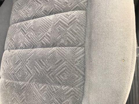 2000 Ford Explorer - Detail of a grey cloth car seat with a geometric diamond weave pattern on the cushion and bolster.
