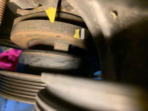 1996 Ford Bronco - The image shows a close-up of a vehicle's engine pulley system with visible timing marks and paint indicators.