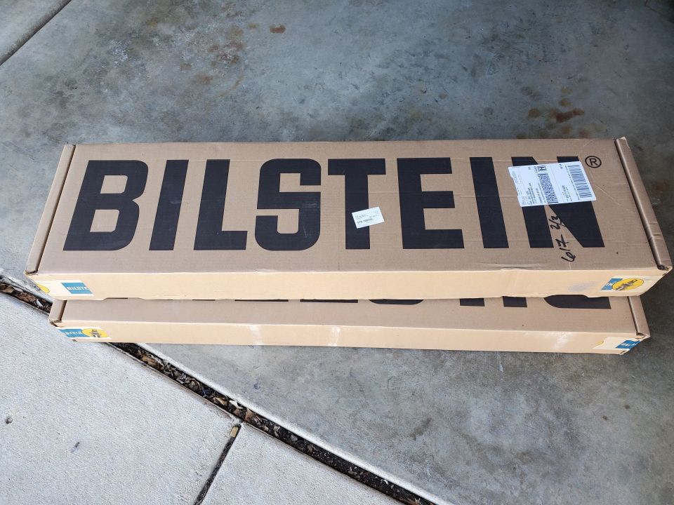 Two Bilstein boxes stacked on concrete