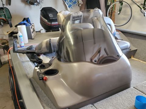 2005 Tracker Tournament - Interior view of a boat's console area, showing the windshield and an outboard motor.