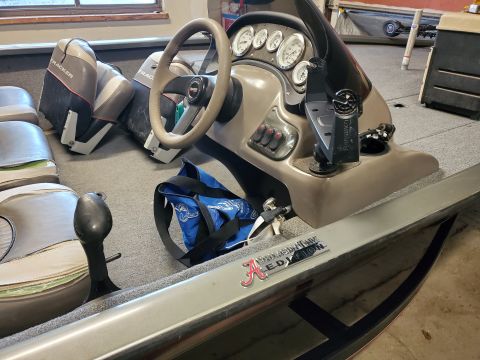 2005 Tracker Tournament - Interior view of a boat's helm and seating area, showing the dashboard and floor.
