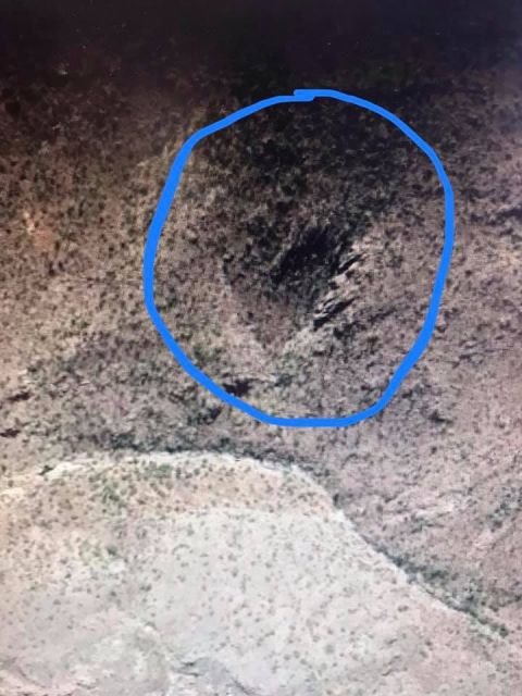 1963 Ford Falcon - This image shows an aerial perspective of a , arid landscape, with a blue circle highlighting a specific section.