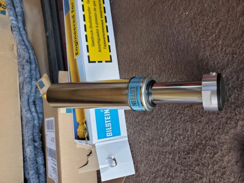 1996 Ford Bronco - A Bilstein shock absorber is shown, with text on its packaging indicating it is a gas pressure shock absorber.