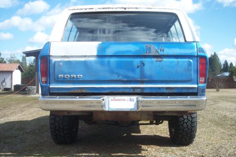 1978 Ford Bronco - Rear view of a 1978 Ford Bronco, showing its tailgate and taillights.