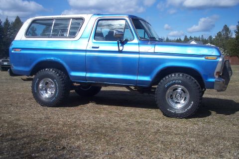 1978 Ford Bronco - This 1978 Ford Bronco is shown from the side with a blue body and white top.