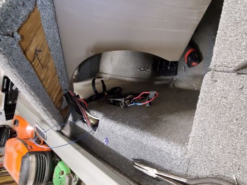 2005 Tracker Tournament - Exposed wiring and electrical components are visible inside the boat's interior.
