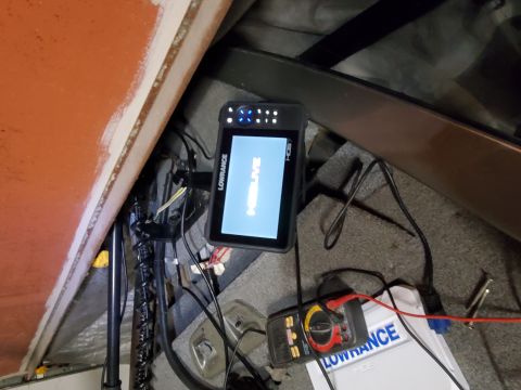 2005 Tracker Tournament - Boat interior showing a Lowrance fish finder and a multimeter with wires connected.
