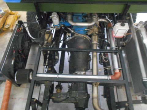 1992 Ford Bronco - Underside view of engine and drivetrain components, showing transmission, exhaust, and other mechanical parts.