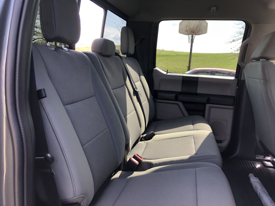 Gray fabric rear seats inside a truck cab