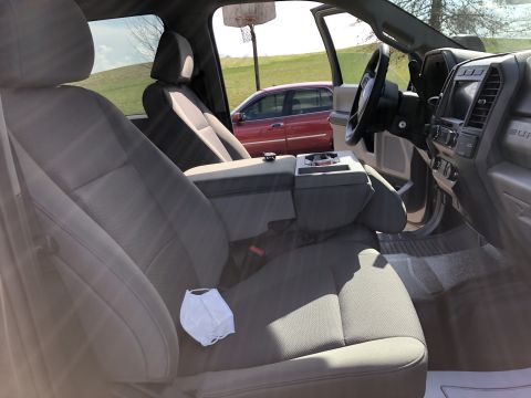2021 Ford F-250 - Interior view of a 2021 Ford F-250 pickup truck, with a face mask on the seat.