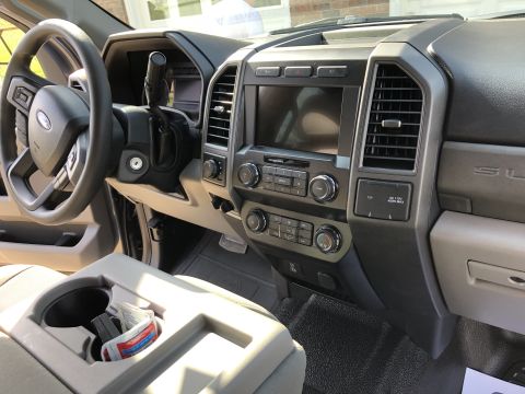 2021 Ford F-250 - The interior of a Ford Super Duty truck, a gray dashboard and center console.