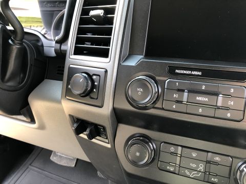 2021 Ford F-250 - Interior view of a truck's center console, showing the 4WD selector and infotainment controls.