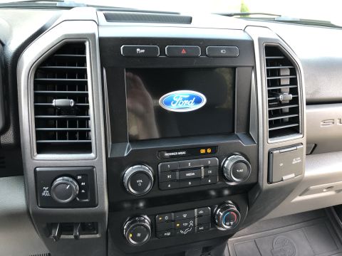 2021 Ford F-250 - 2021 Ford F-250 interior features the Ford infotainment system and climate controls.