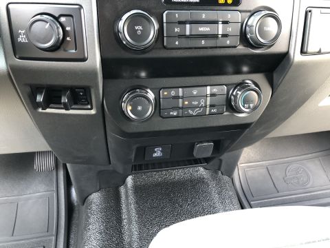 2021 Ford F-250 - Interior view of a 2021 Ford F-250, showing the center console with climate and media controls.