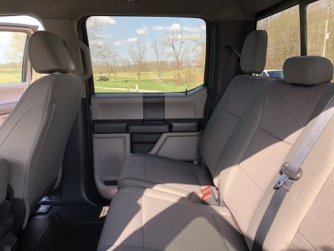 2021 Ford F-250 - View from the back seat of a truck, showing the interior and the landscape outside.