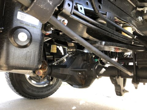 2021 Ford F-250 - Close-up of a vehicle's rear axle and suspension system, showing various mechanical parts.