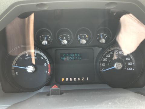 2011 Ford F-250 - The vehicle's dashboard displays average MPG, mileage, and gear selection.