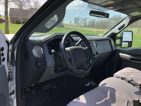 2011 Ford F-250 - The interior of a Ford Super Duty truck, the dashboard and steering wheel.