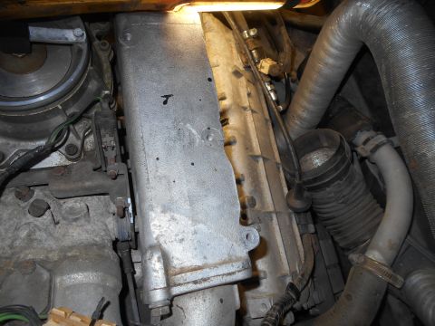 1992 Ford Bronco - Close-up view of engine components including intake manifold and various hoses.