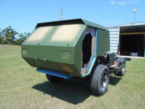 1992 Ford Bronco - Unfinished custom vehicle with a military-style body is shown outdoors.
